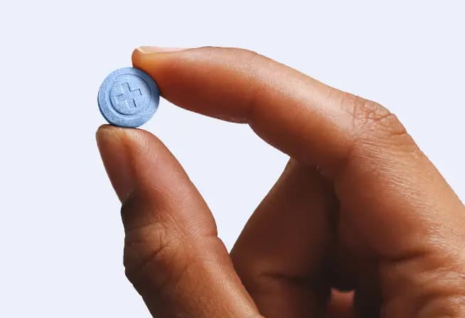 Person holding  tablet infront of envelope