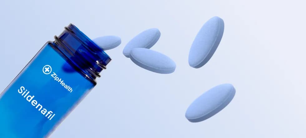 ZipHealth ED medication bottle and pills on a light blue background