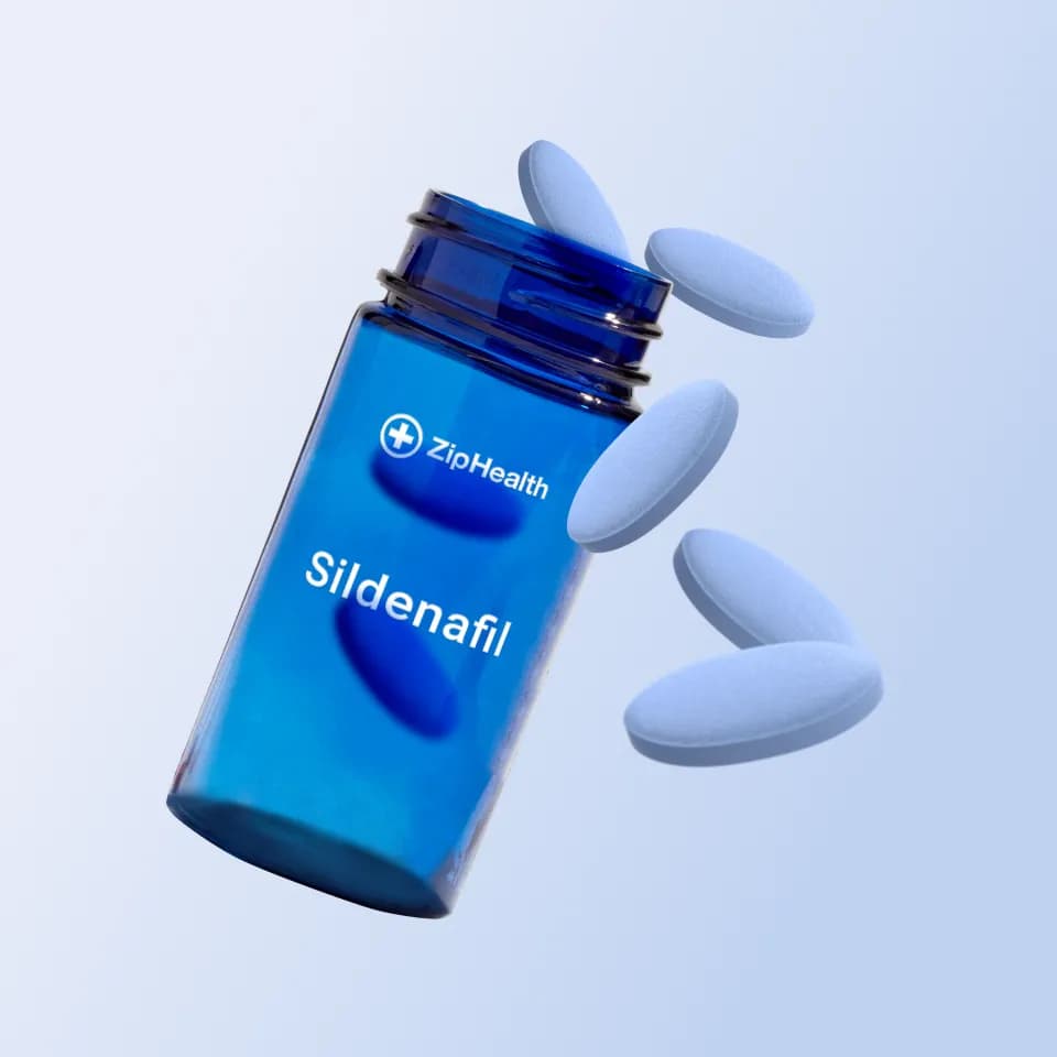 ZipHealth ED medication bottle and pills on a light blue background